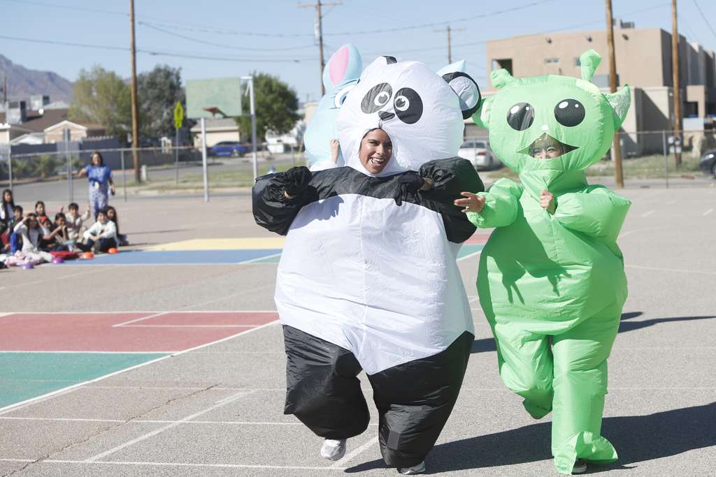 2nd annual teacher inflatable costume race. Panda and alien racing