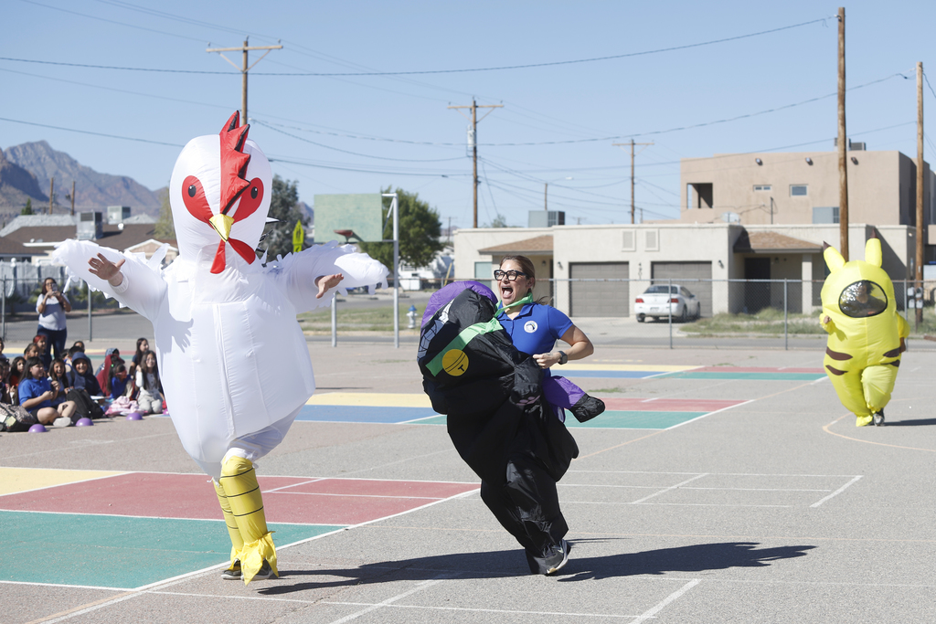2nd annual teacher inflatable costume race. Chicken and cat racing