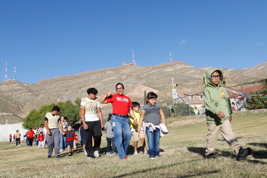 Moreno students and Austin football players walking together