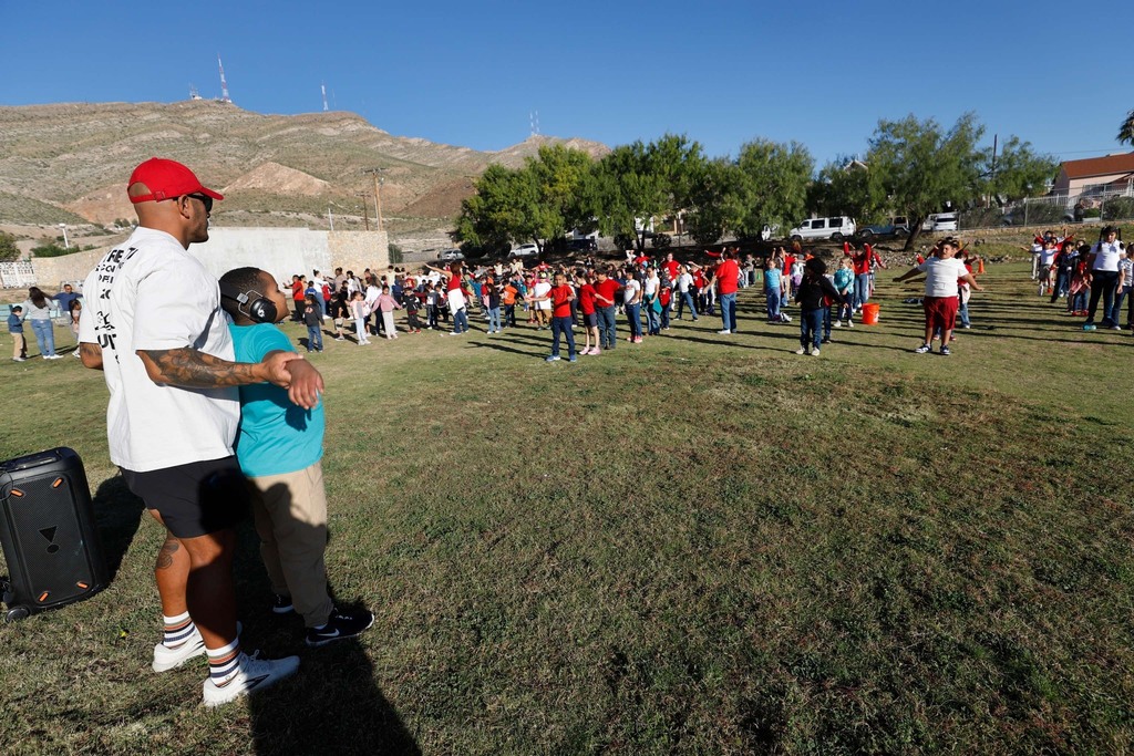Moreno students doing a group stretch before going on a walk