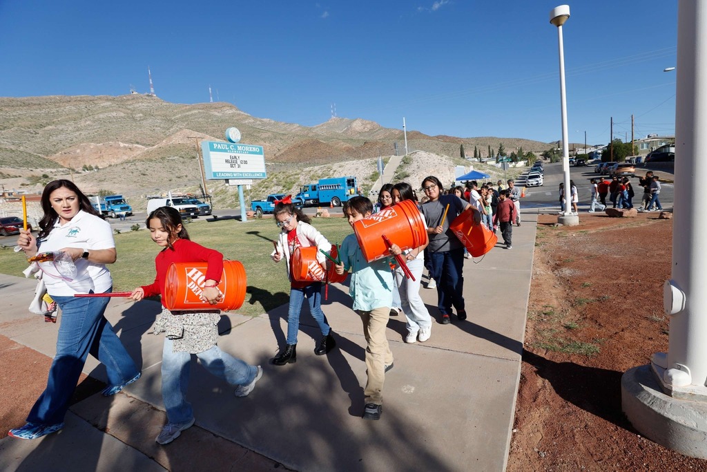 Moreno students walking while playing "drums"