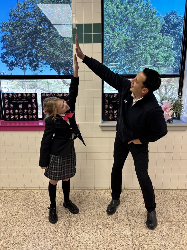 Job Gracia and student whose life he saved high fiving