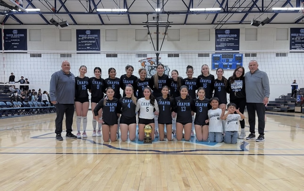 Chapin High School volleyball team takes group photo with bi-district trophy
