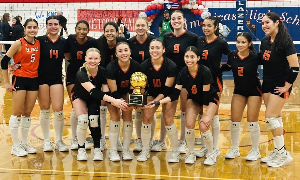 El Paso High School volleyball team takes group photo with bi-district trophy