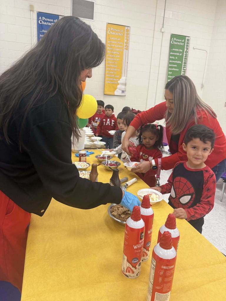 Sunrise Mountain Elementary School student smiles while being served ice cream