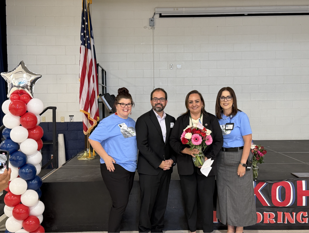 Kohlberg staff and Texas Representative Joe Moody take a photo