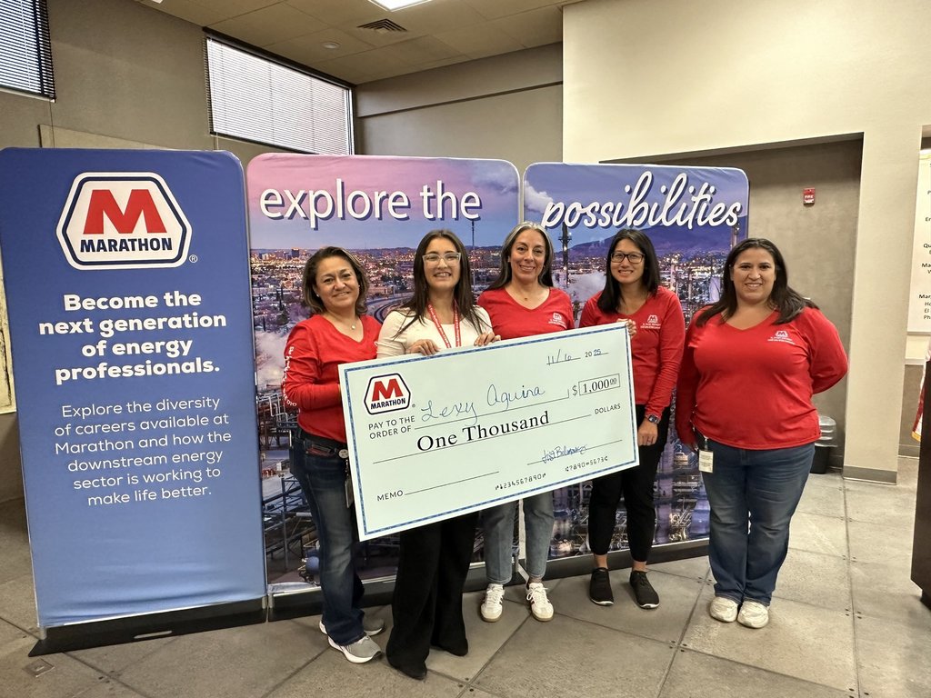 Burges High School’s Lexi Aguina, recipient of a $1,000 Marathon scholarship poses with Marathon employees and giant check