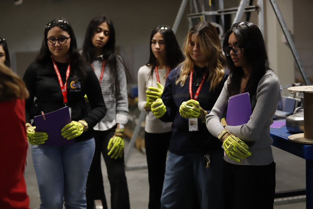 Students listening to Marathon Refinery presentations