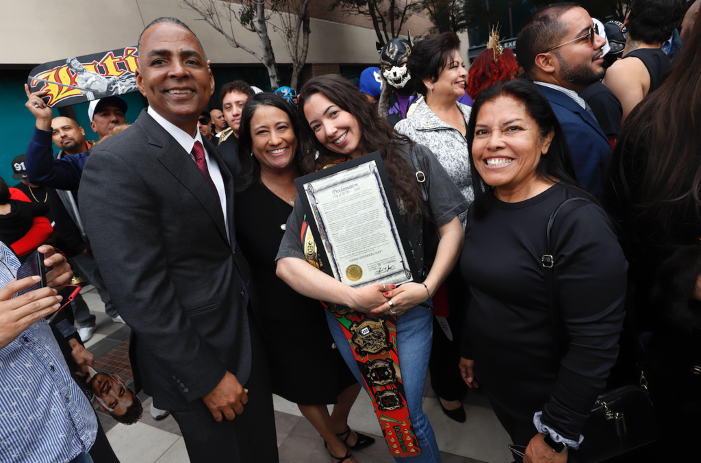 Mayor of El Paso and Eddie Guerrero family members take a photo together