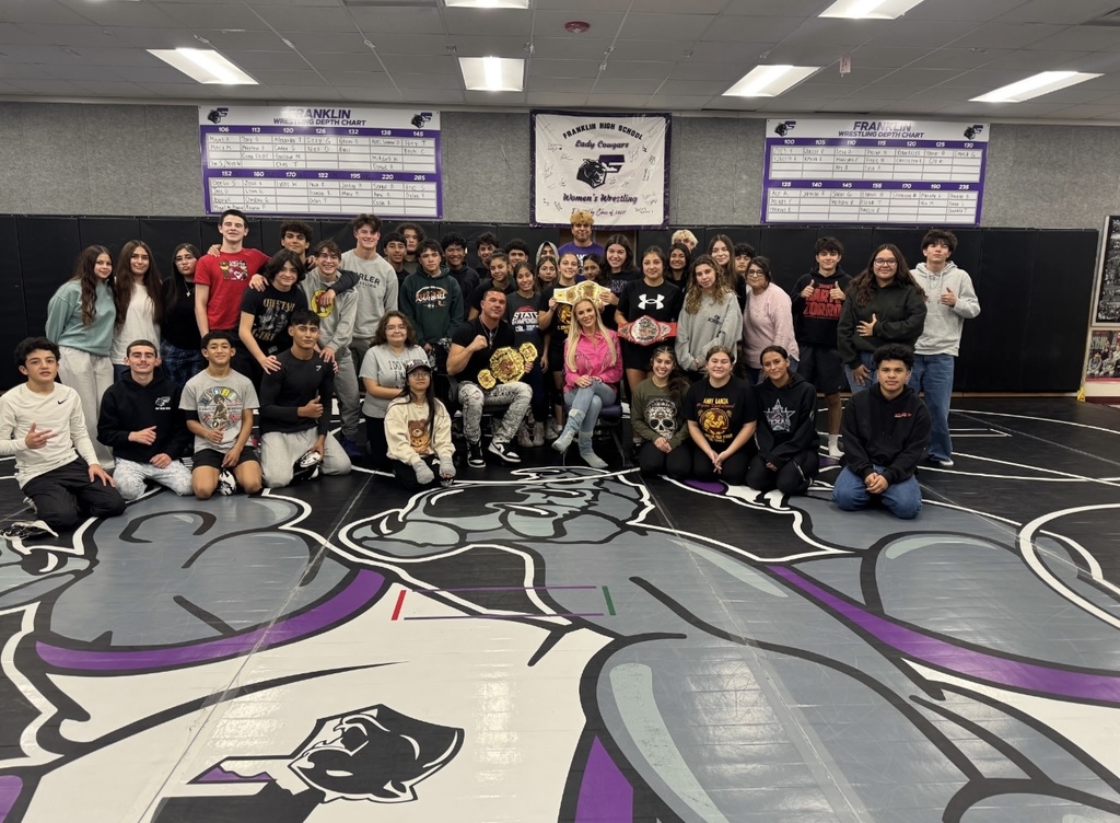 Franklin High School Wrestling takes group photo with TNA stars Ashley Diaz de Villegas and Frankie Kazarian