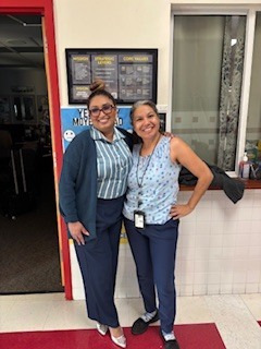 PRINCIPAL AN CLERK WEARING BLU E