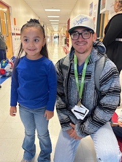 TEACHER AND STUDENT WEARING BLUE