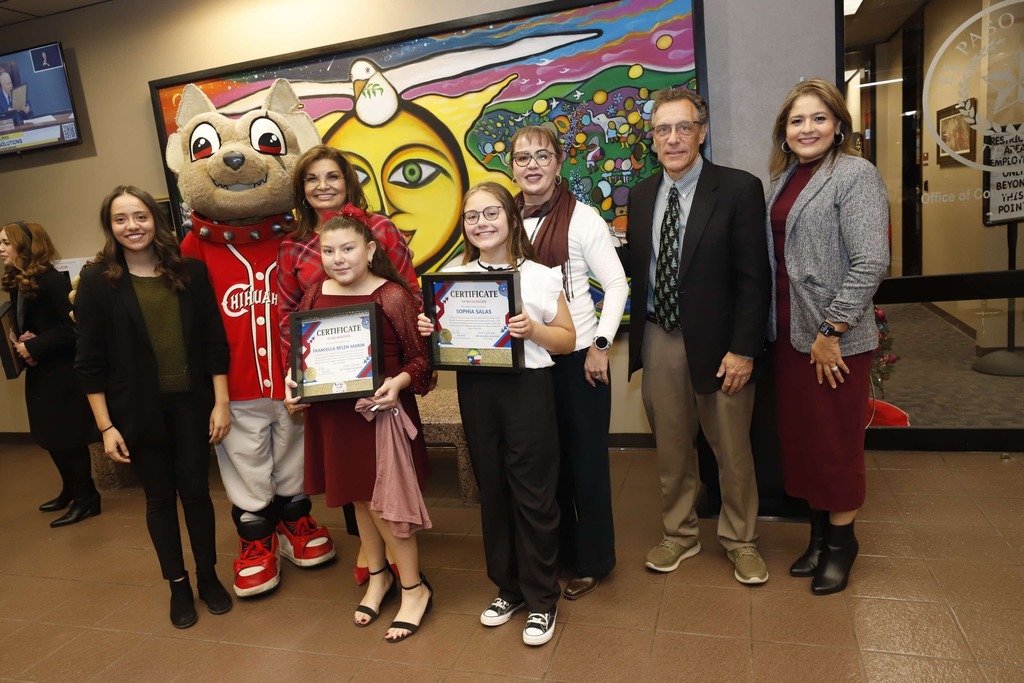 El Paso ISD students Sophia Salas and Francella Belen Marin get recognized for their outstanding designs in the "Future Voter" Sticker Design Contest and take a group photo with City reps, Interim Superintendent Martha Aguirre, Lamar Elementary principal, and El Paso ISD staff