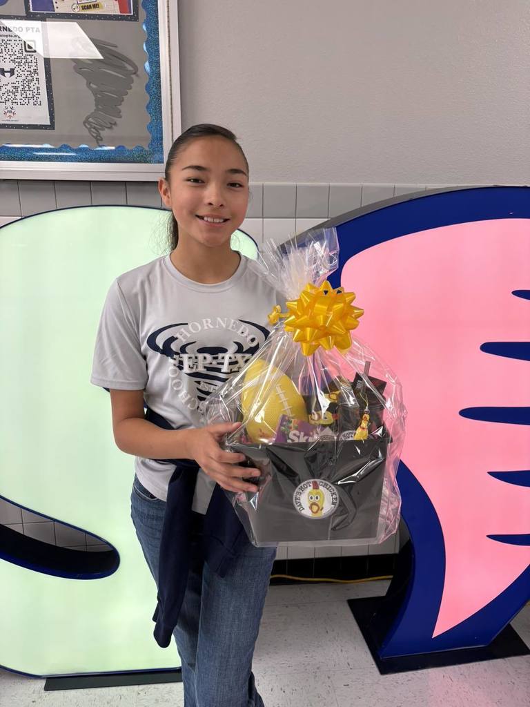 Hornedo student with their perfect attendance goodie basket