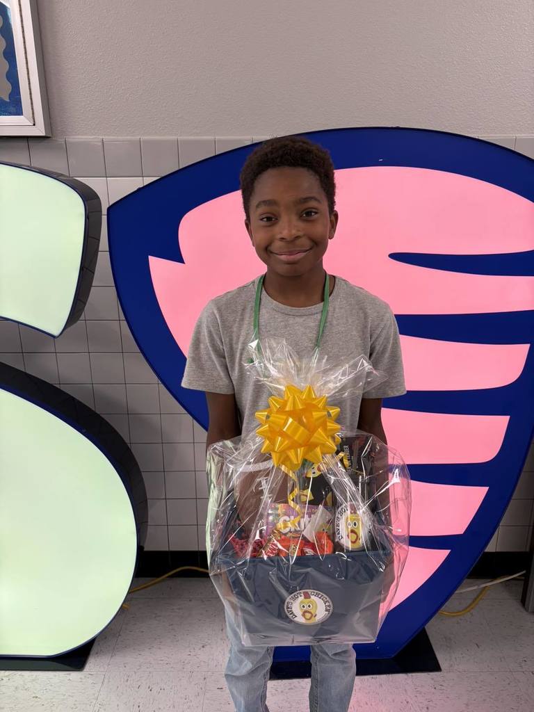 Hornedo student with their perfect attendance goodie basket