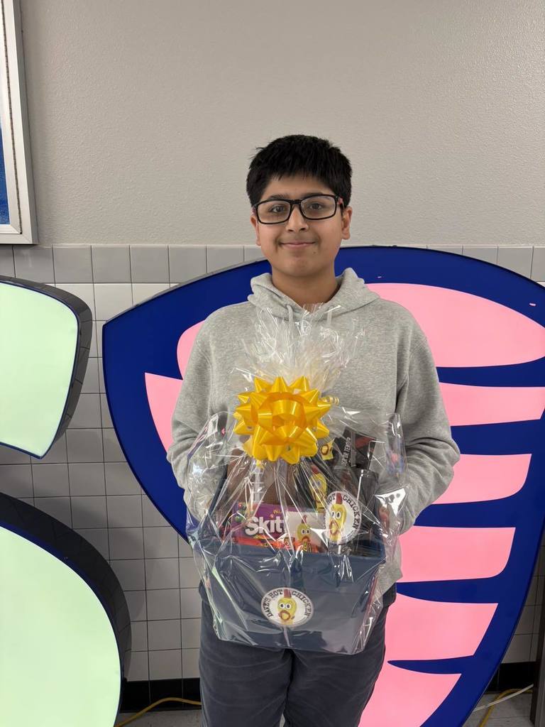 Hornedo student with their perfect attendance goodie basket