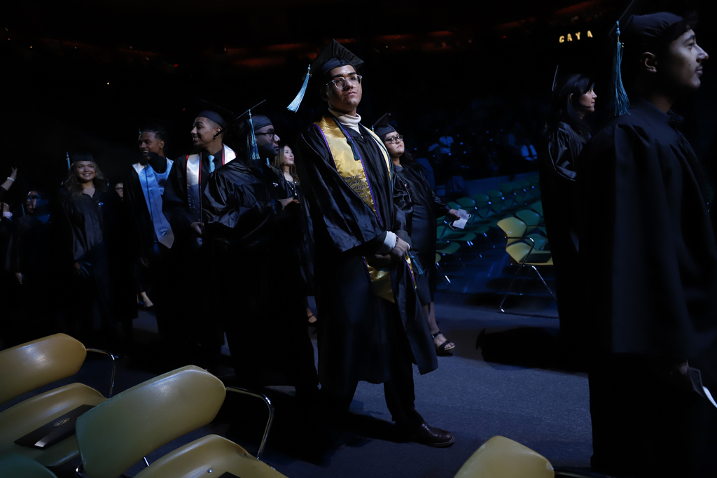 Burges Early College High School student walking into the EPCC graduation ceremony