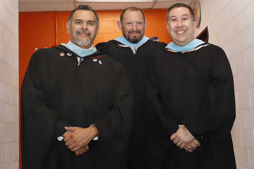 Andress High School and Burges High School principal and Assistant principal smile for a photo