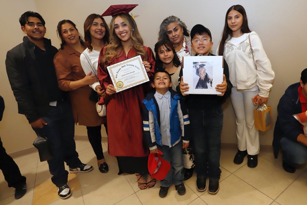 San Jacinto Adult Learning Graduate student takes group photo with her family