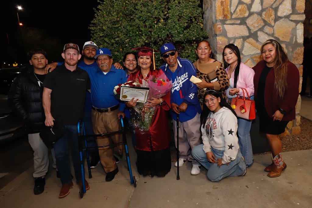 San Jacinto Adult Learning Graduate student takes group photo with her family