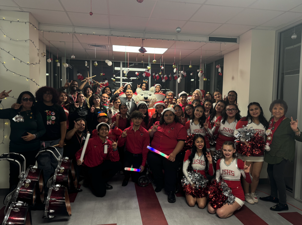 Jefferson Silva  stuco, students, and staff take group photo at lighting of the heart
