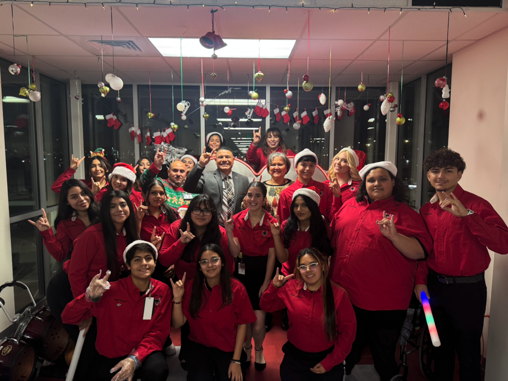 Jefferson Silva stuco and staff take group photo at lighting of the heart