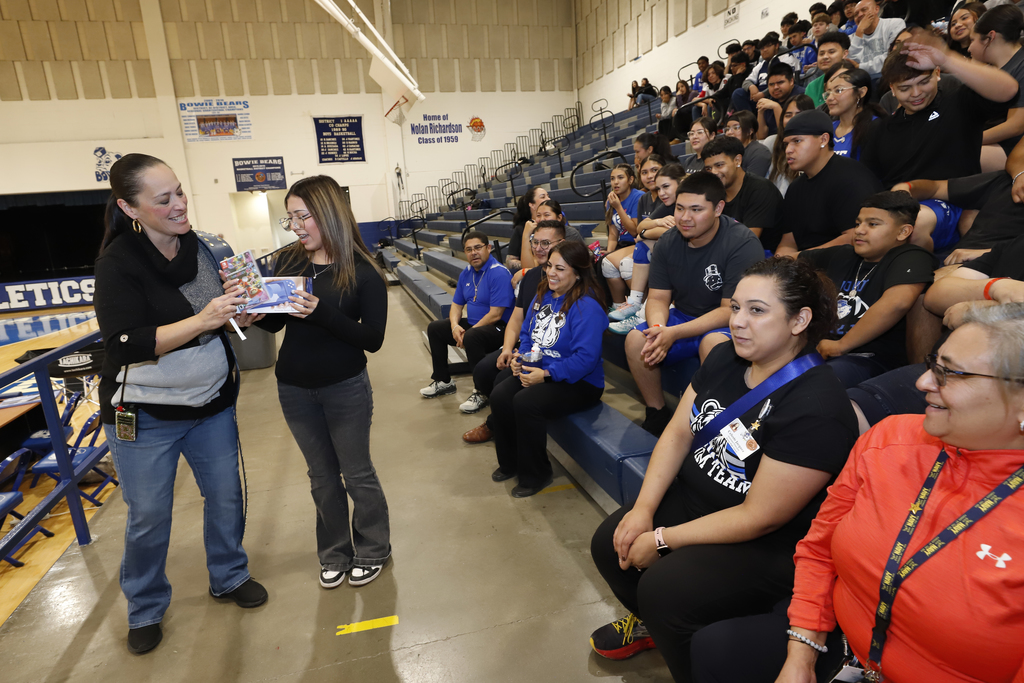 Bowie High School principal gives student  a Nintendo Switch for perfect attendance while faculty and students watch and cheer