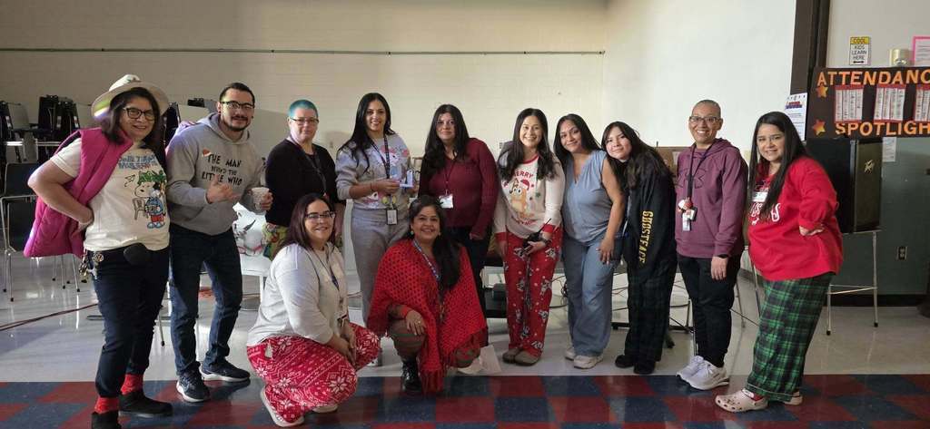Photo of Magoffin Middle School staff at the perfect attendance dance in the cafeteria