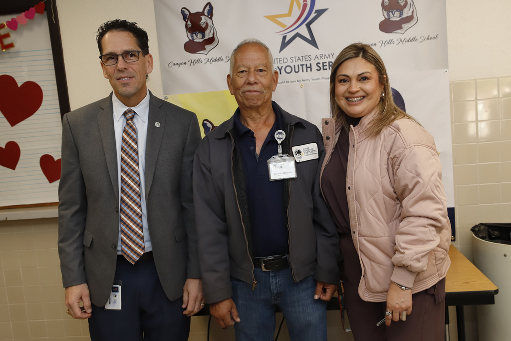 Superintendent Dr. Brian Lusk,  Canyon Hills Middle School principal, and staff member take group photo