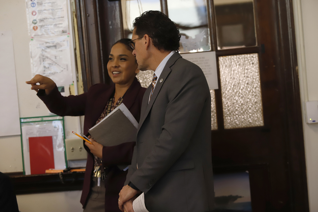 Superintendent Dr. Brian Lusk talking with Austin High School principal 