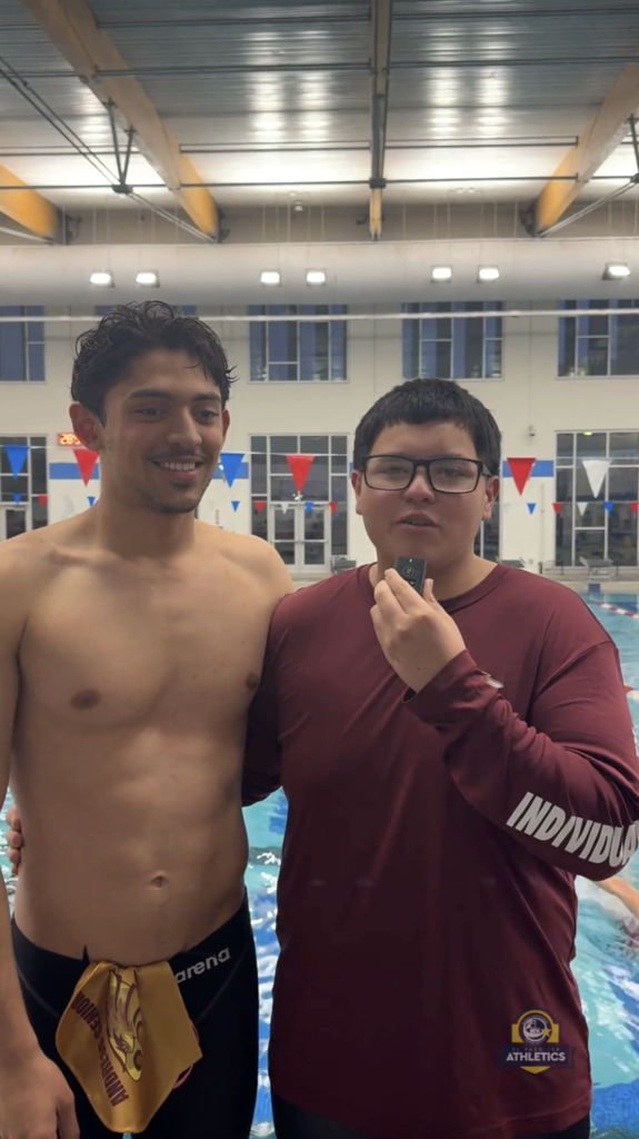 Andress boys swimmers answering questions