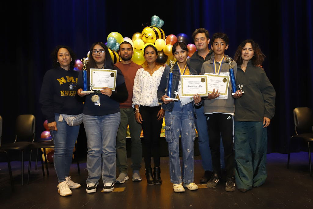 El Paso ISD students who earned top spots in the District Spanish Spelling bee take a group photo with their parents