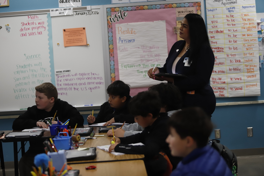 Coronado High School Principal Angela Reyna watches students at Murphree PK-8 learn in the classroom