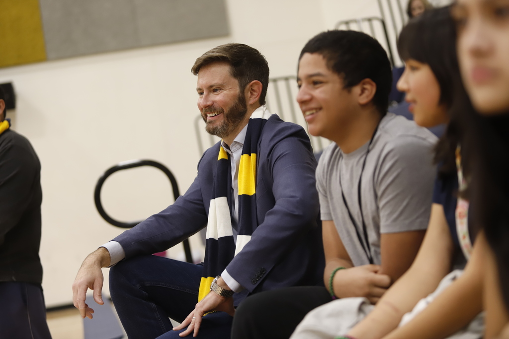Dr. Jack Loveridge watches Navarette Middle School  students perform at pep rally