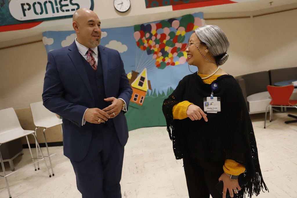 Trustee Alex Cuellar talks to MacArthur PK8 principal
