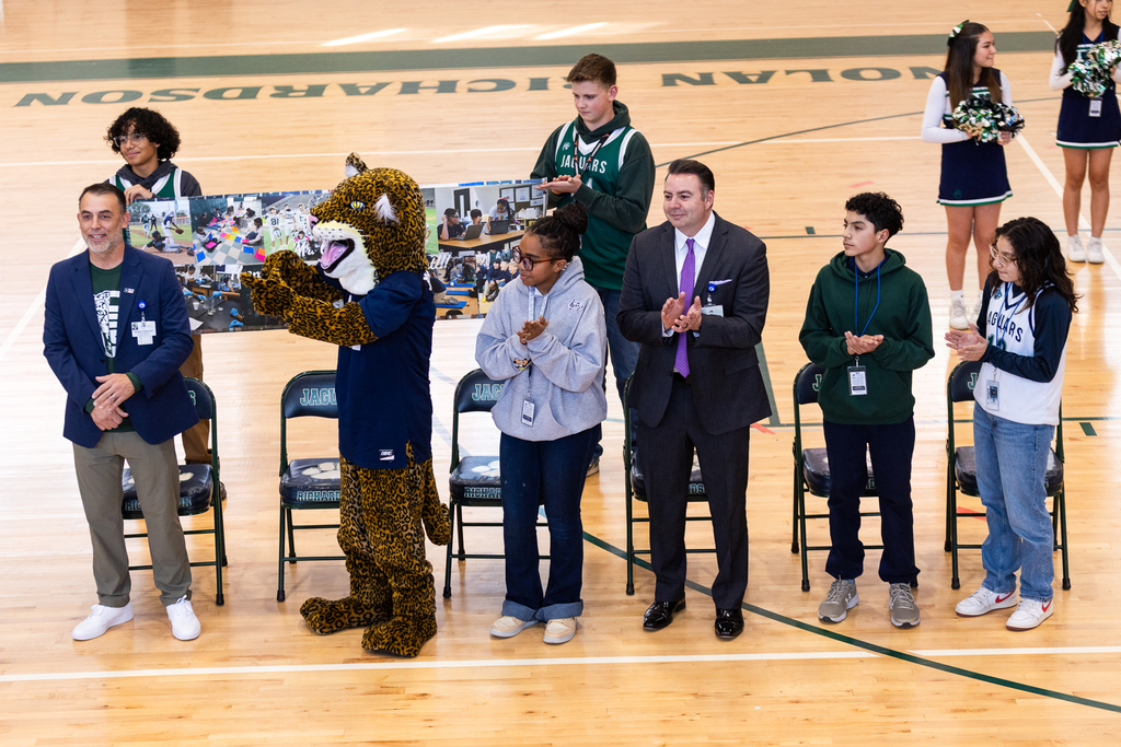 Richardson Middle School cheer on Trustee Robert Osterland