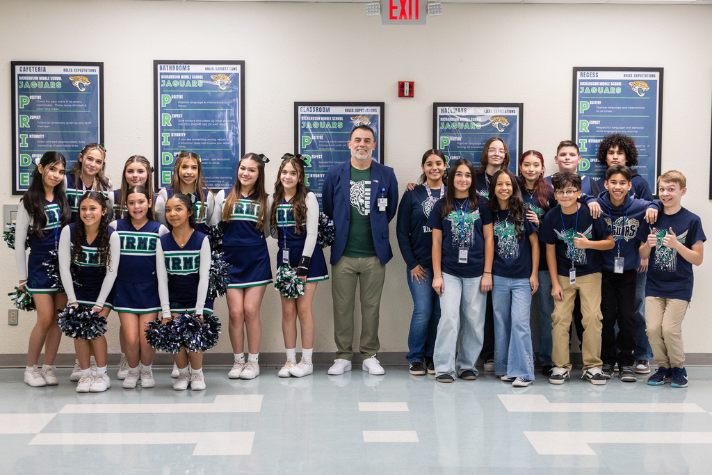 Trustee Robert Osterland with Richardson Middle School cheerleaders and drumline