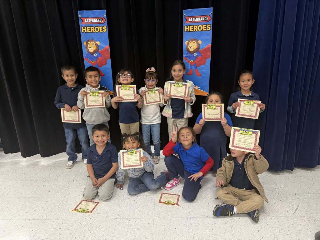 Sunrise Mountain Elementary School students show off perfect attendance certificates