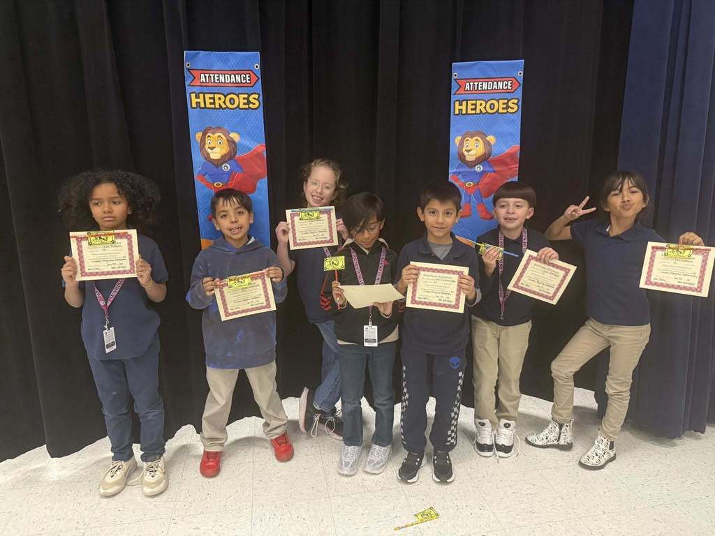 Sunrise Mountain Elementary School students show off perfect attendance certificates