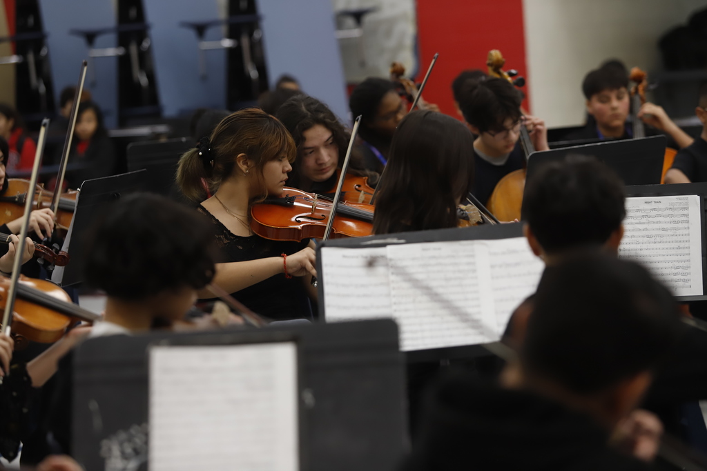 Magoffin Middle School orchestra performing for Trustee Mindy Sutton
