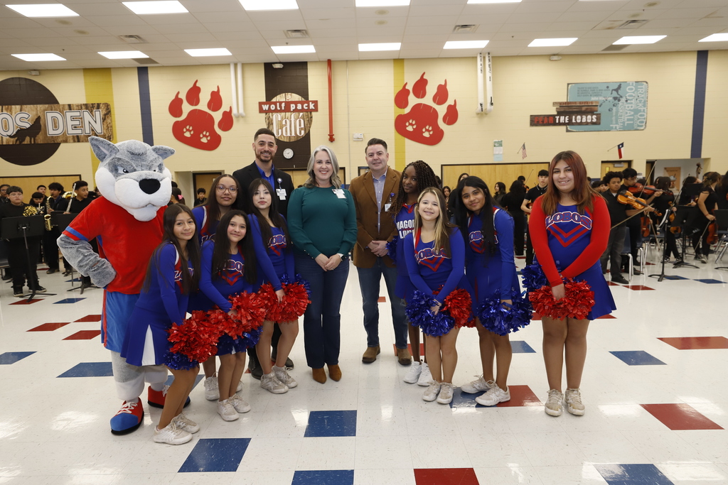 Magoffin Middle School cheerleaders and band take group photo with Trustee Mindy Sutton