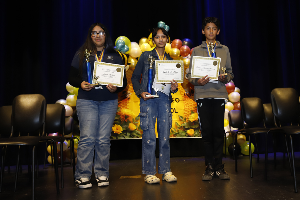 El Paso ISD District Spanish Spelling Bee winners take group photo together. Pictured: Emiliano Ferrán Martinez Caloca, Wiggs Middle School, Shaheli De Silva, Young Women's STEAM Prep Academy, and Luna Milian, Navarette Middle School