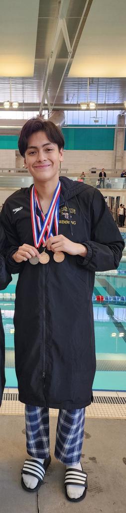 Austin High School State Qualifier Swimmer Cesar Chavez smiles for a photo