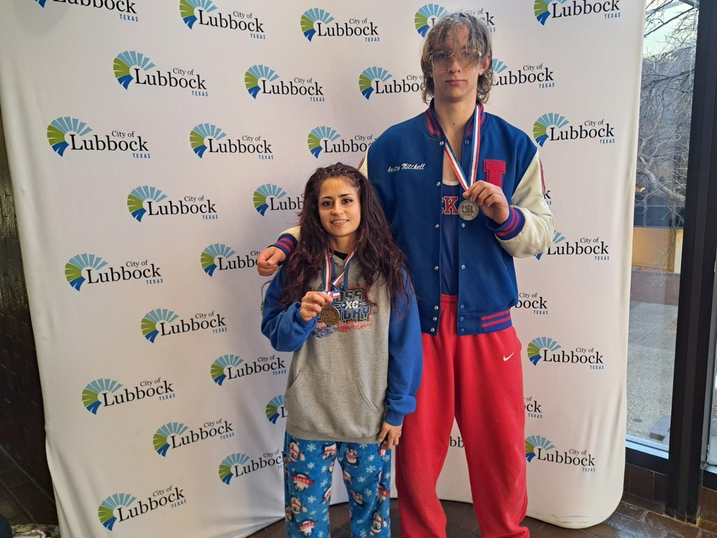 Irvin High School State Qualifier Wrestlers smile for a photo