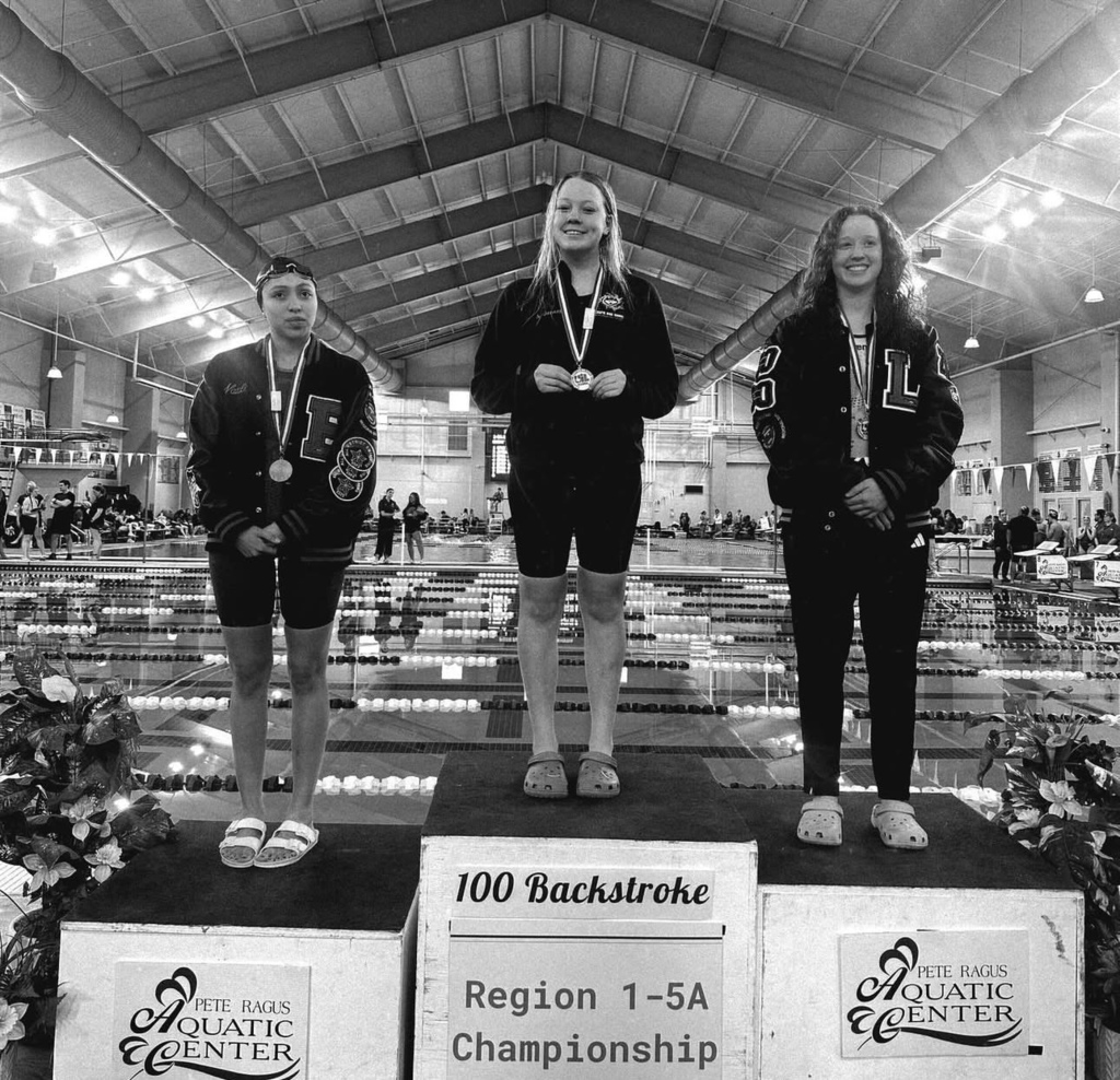 Chapin High School State Qualifier Swimmers smile for a photo