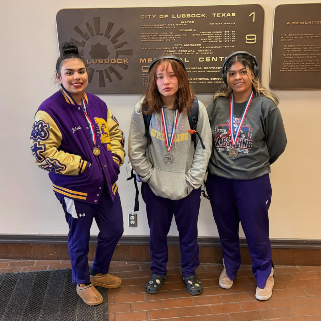 Burges High School State Qualifier Wrestlers smile for a photo