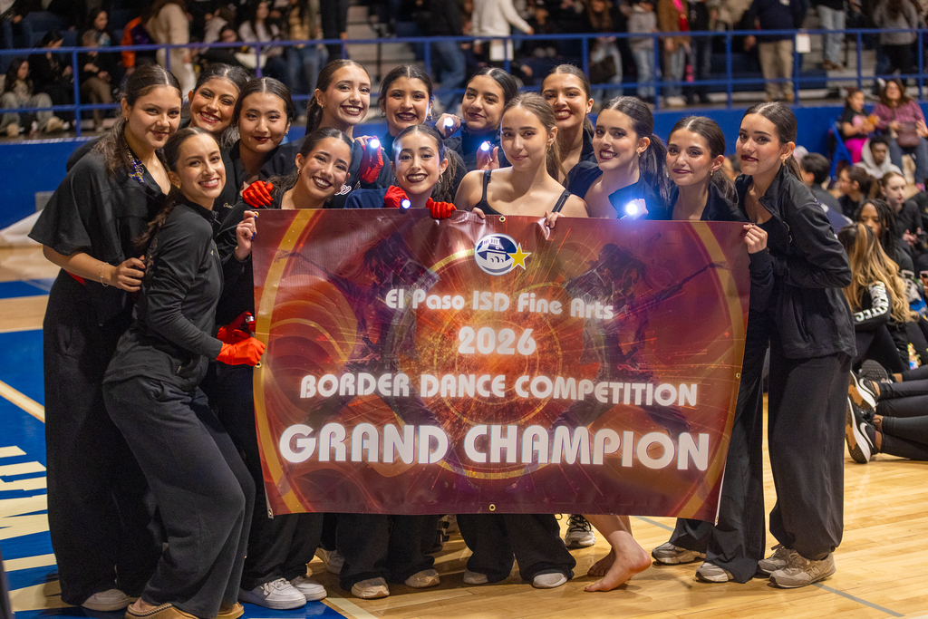 Coronado High School Dance Company takes a group photo with Grand champion banner