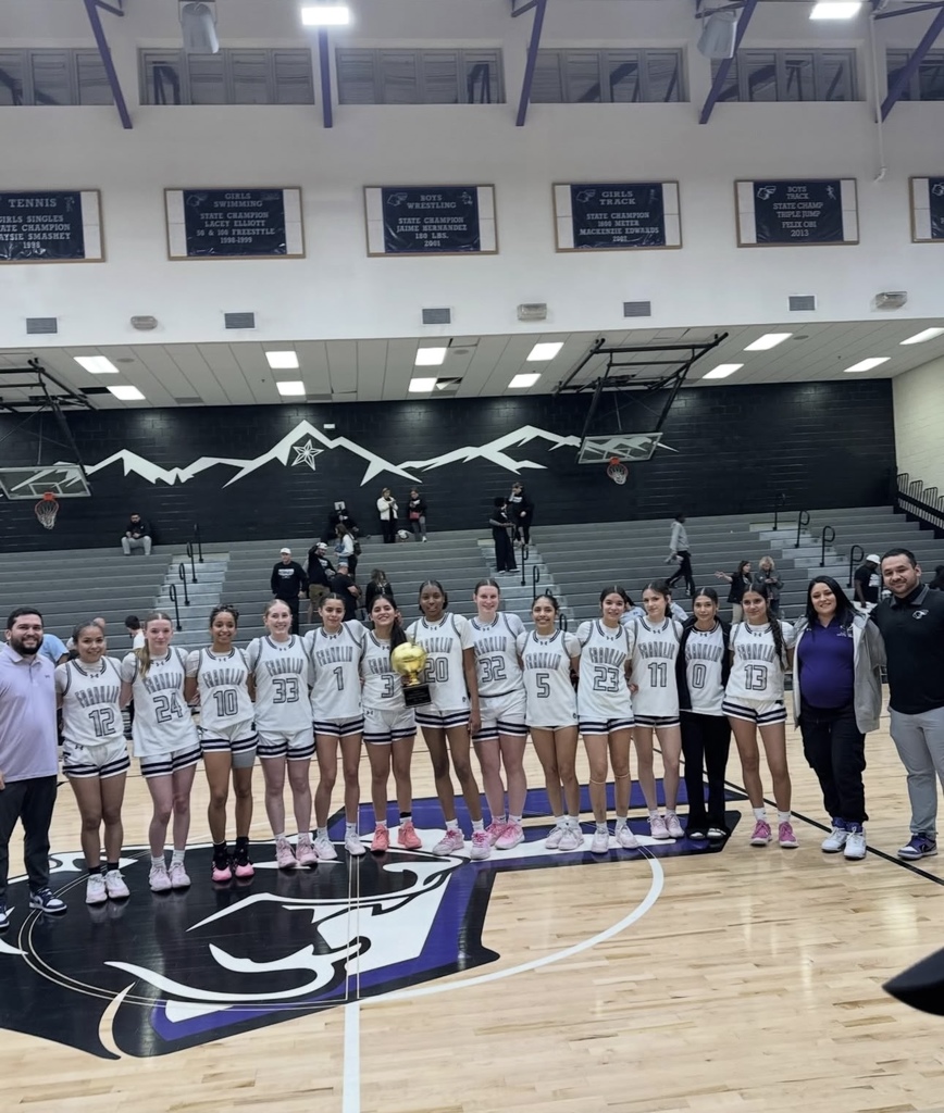 Photo of Franklin High School girls basketball team with their bi-district champions trophy