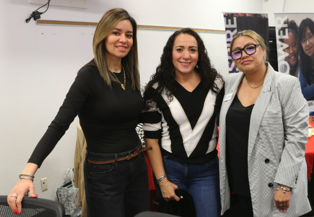 Three El Paso ISD Council of PTAs volunteers smile for a group photo
