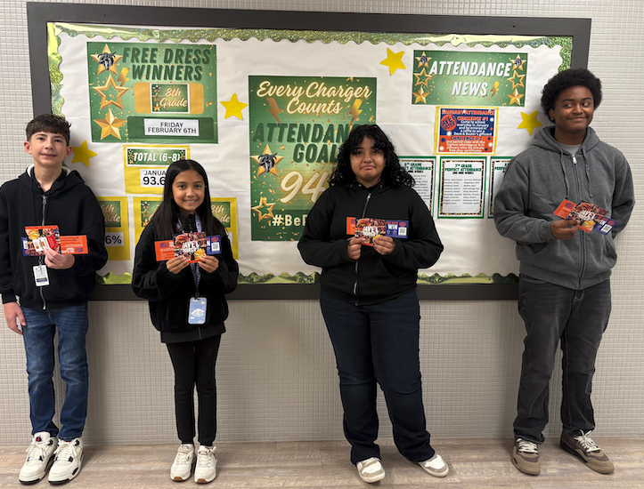 Charles Middle School students take a group photo with their Dave and Busters certificates